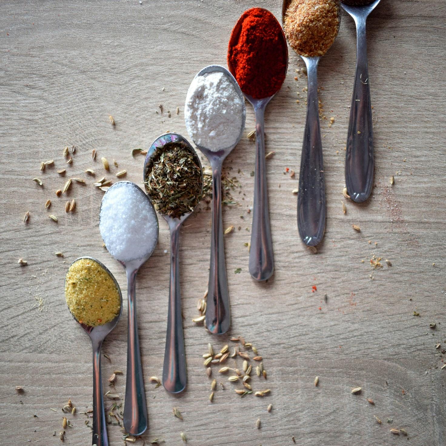Community members collaborating in a modern kitchen space, sharing recipes and cooking techniques